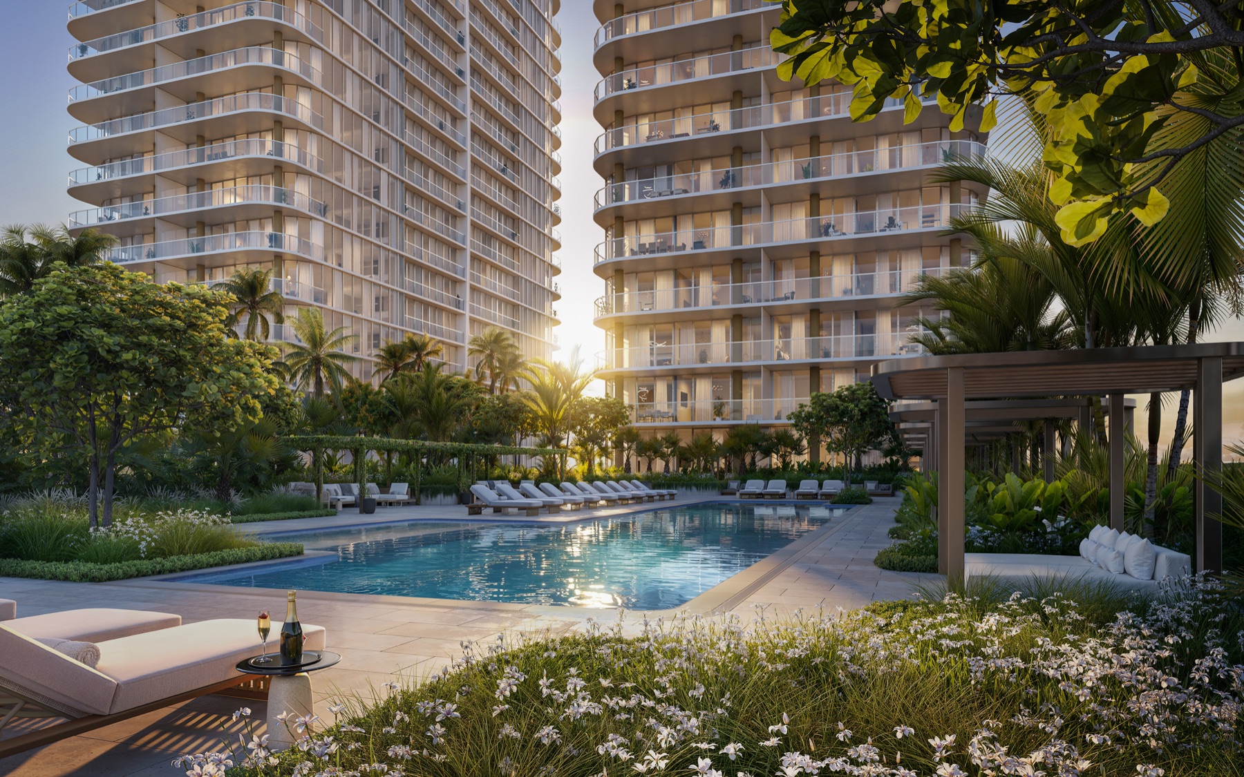 North Tower pool deck — 85' lap pool with sun shelf, open-air cabanas, heated loungers.