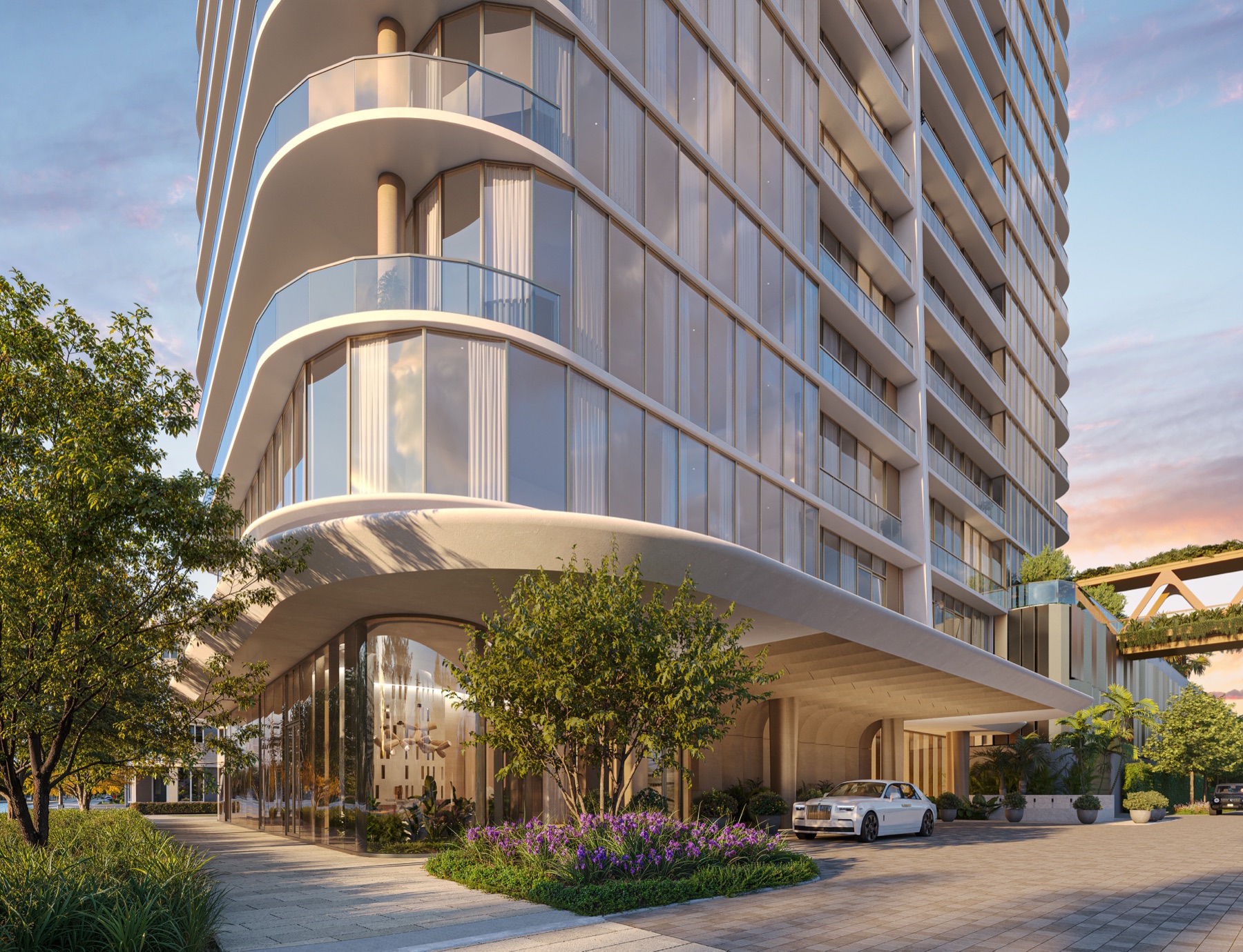 Townhome arrival — private porte-cochère with water feature.