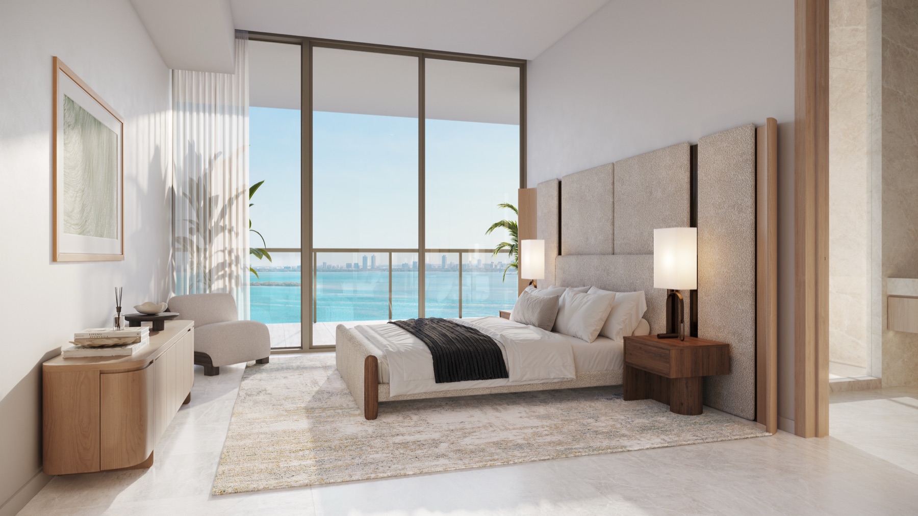 Primary suite with natural stone flooring and oversized custom walk-in closet.